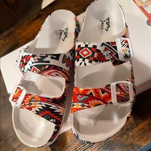 Red aztec print sandals. SIZE UP ONE SIZE